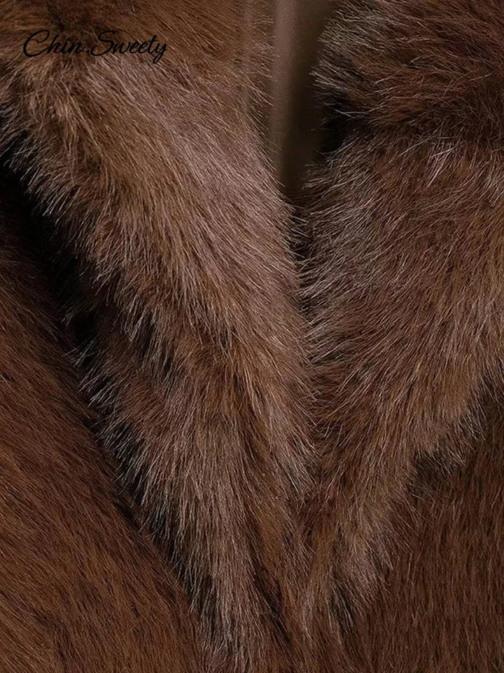 Close-up of brown faux fur with brand name 'Ciao Sweety' in the corner.
